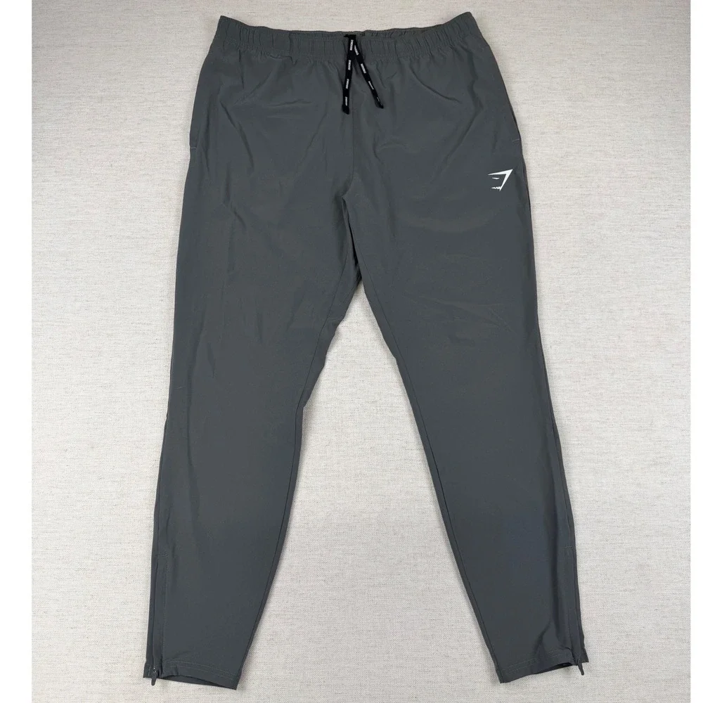 Gymshark Arrival Woven Joggers Mens Large Charcoal Grey Slim Tapered Zip Ankle